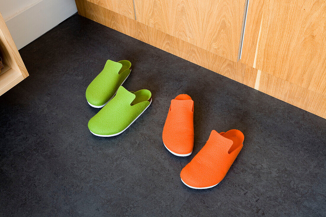 Green and orange slippers in London home UK
