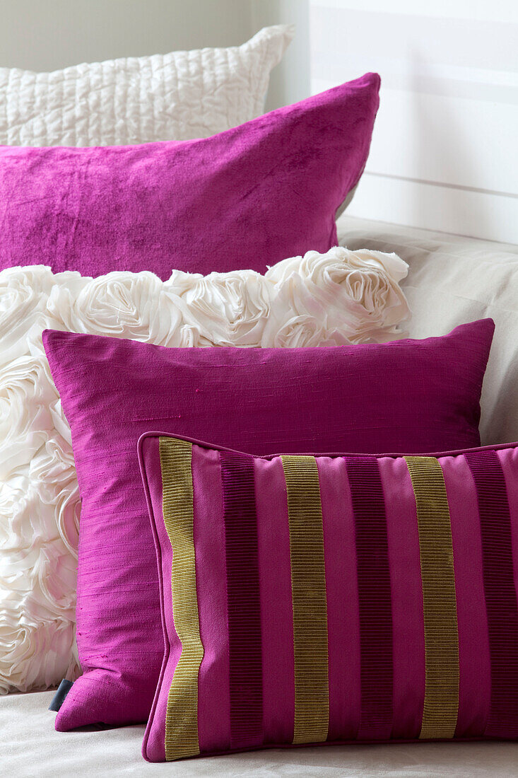 White and pink cushions in contemporary London home, UK