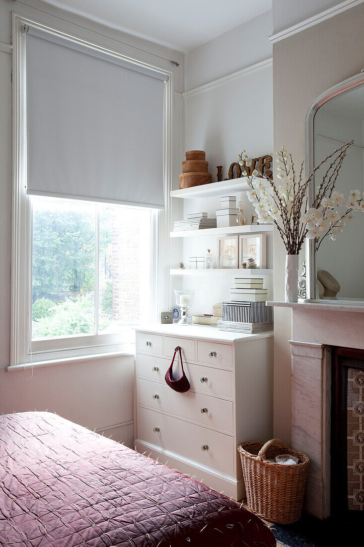 Bedroom shelving at window in contemporary London home, UK
