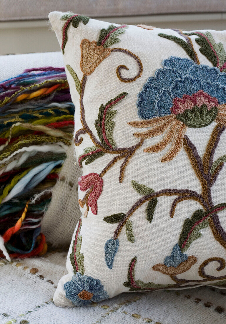 Embroidered cushion and wool in Surrey home