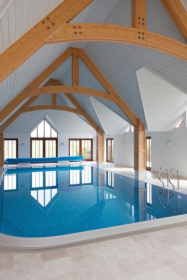 Luxury pool with beamed pitch ceiling in Sussex home UK
