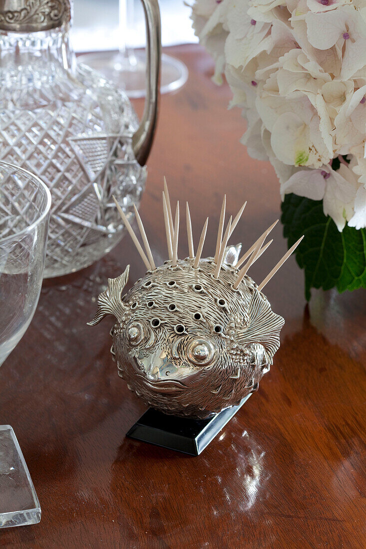 Antique silver toothpick holder on polished tabletop in London townhouse, England, UK