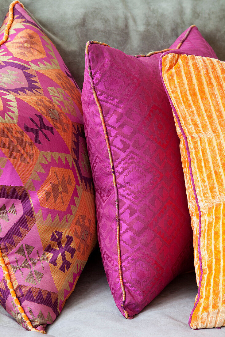 Close up of three cushions in contemporary London family home, UK