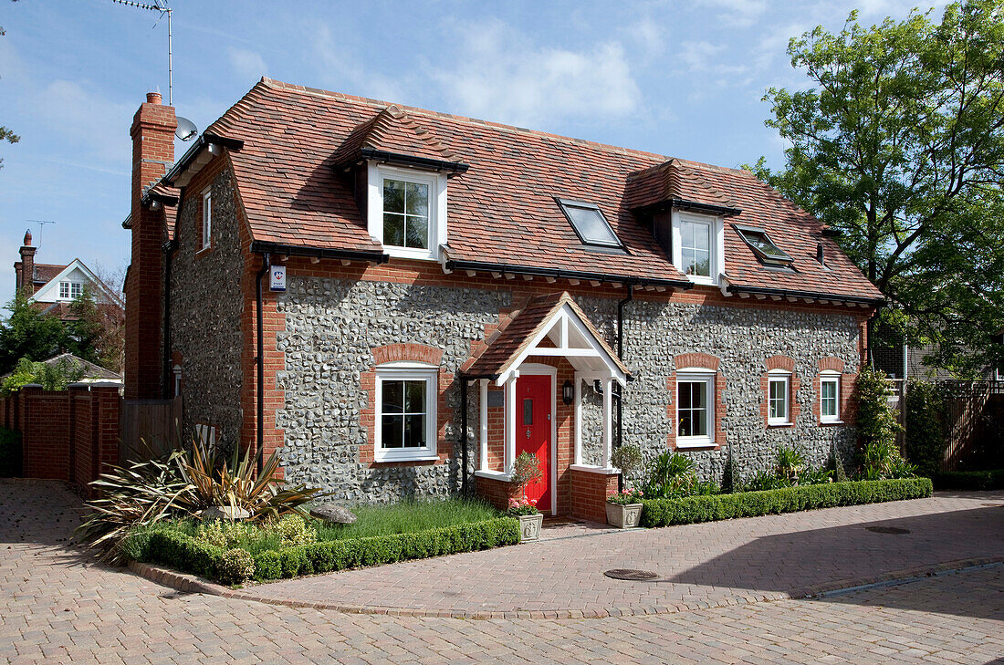 Detached stone and brick cottage in Kent, England, UK