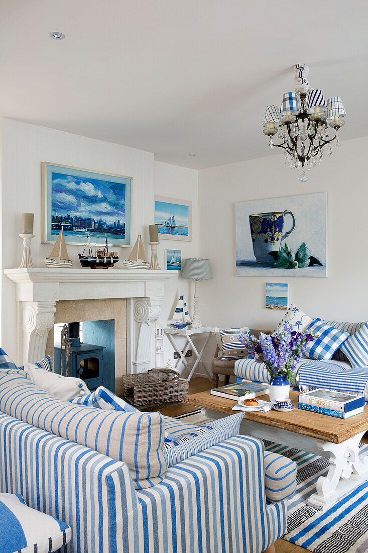 Striped sofas with wooden coffee table in living room of Dulwich home, London, England, UK
