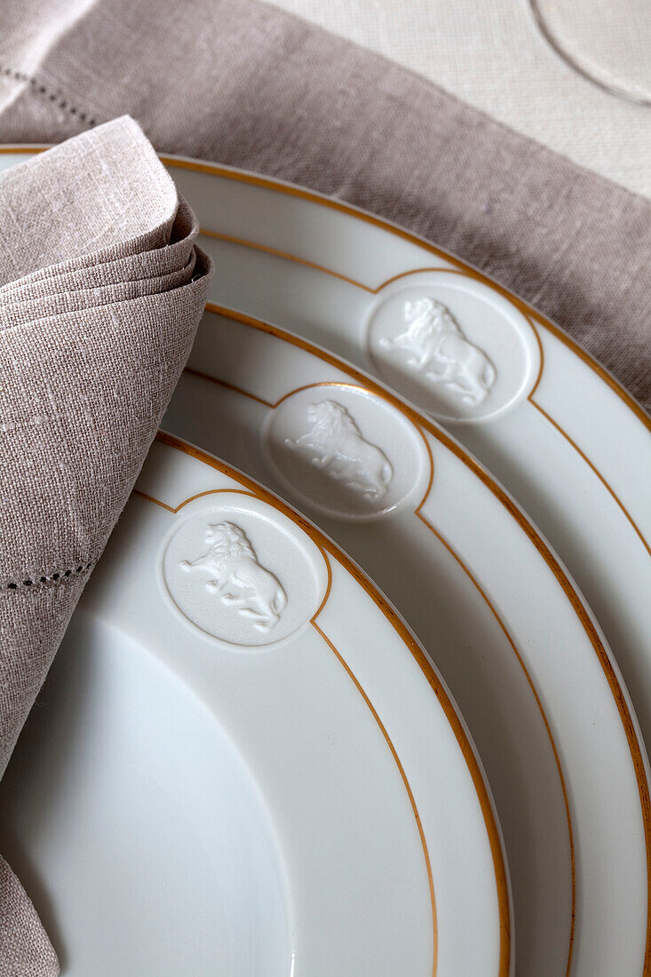 Lion motif on plates in Sussex country house, England, UK