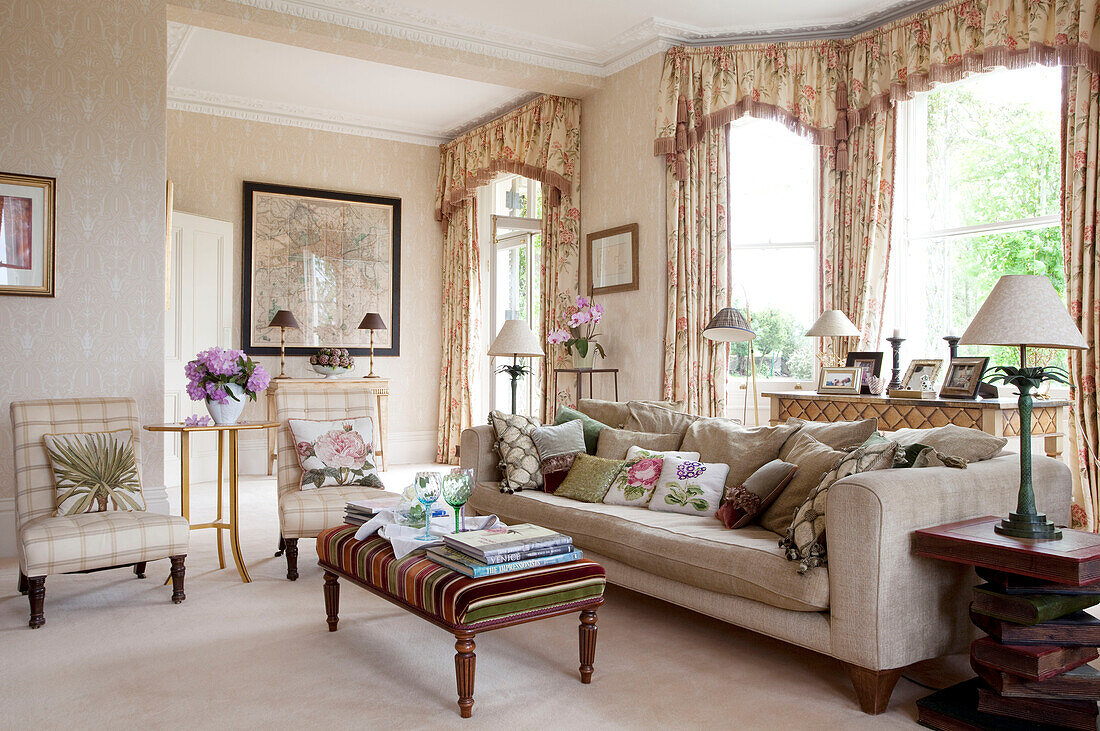Floral curtains with pelmets in cream living room of Sussex country house, England, UK