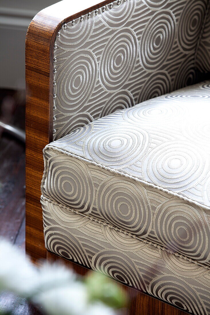 Upholstery detail on Vintage 1940?s Danish armchair in London townhouse, England, UK