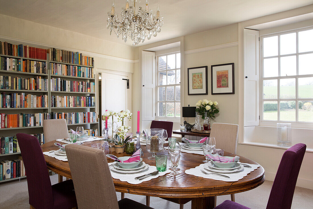 Dining room with bookshelves in London home England UK