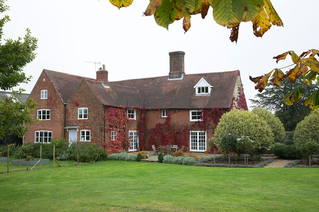 Brick exterior of detached London home in Autumn,  England,  UK