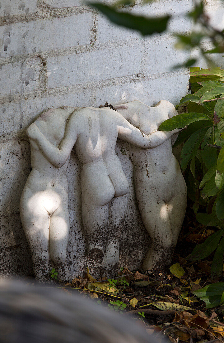 Fragment of naked female figures in Berkshire garden,  England,  UK