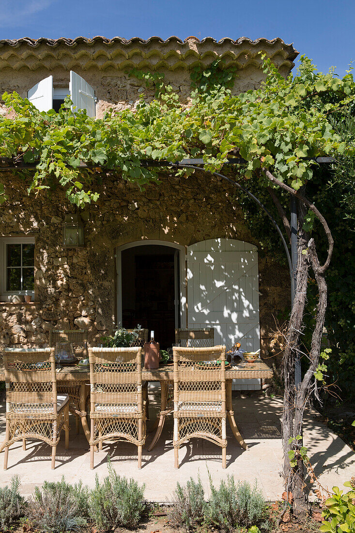 Shaded table below pergola at exterior of Var farmhouse Provence France