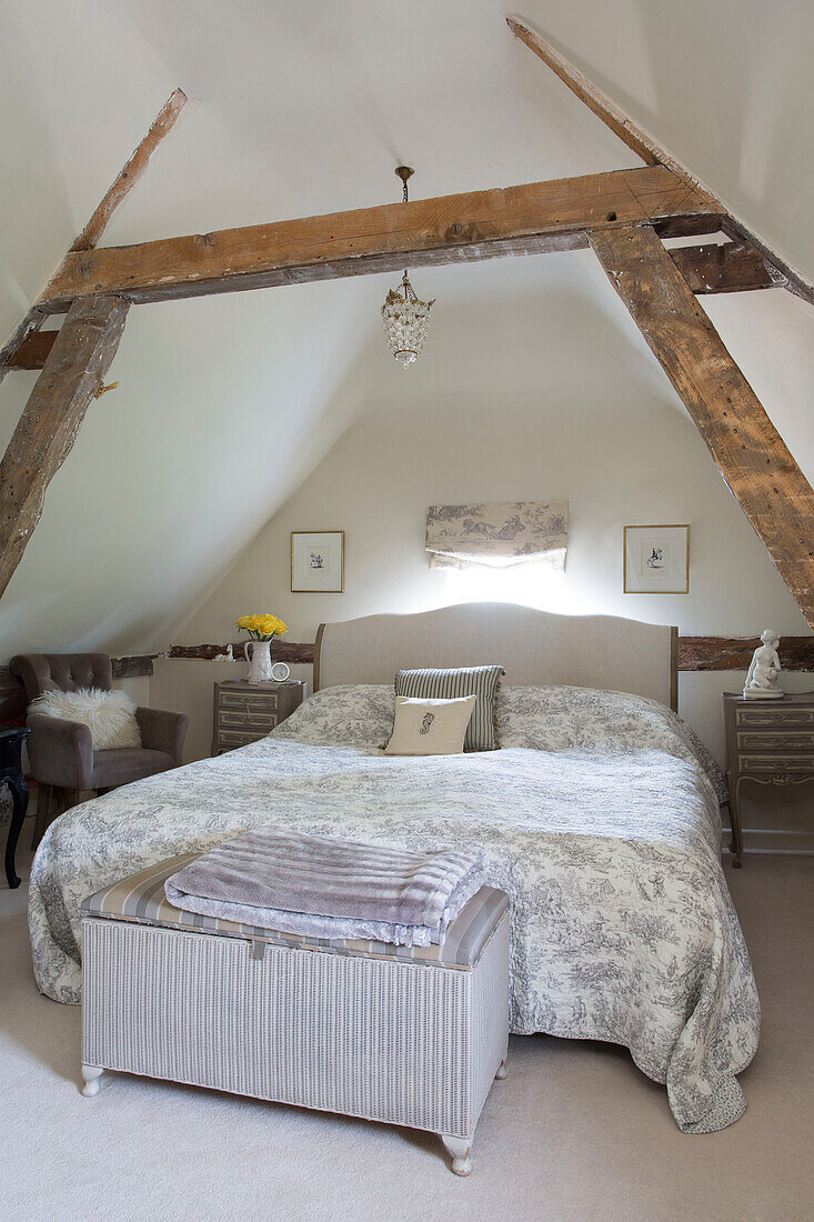 Double bed in attic ov Grade II listed cottage in Hampshire England UK