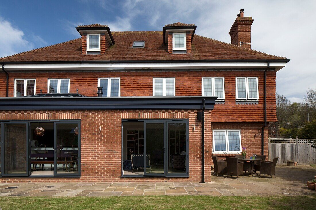 Brick extension to detached Sussex home England UK