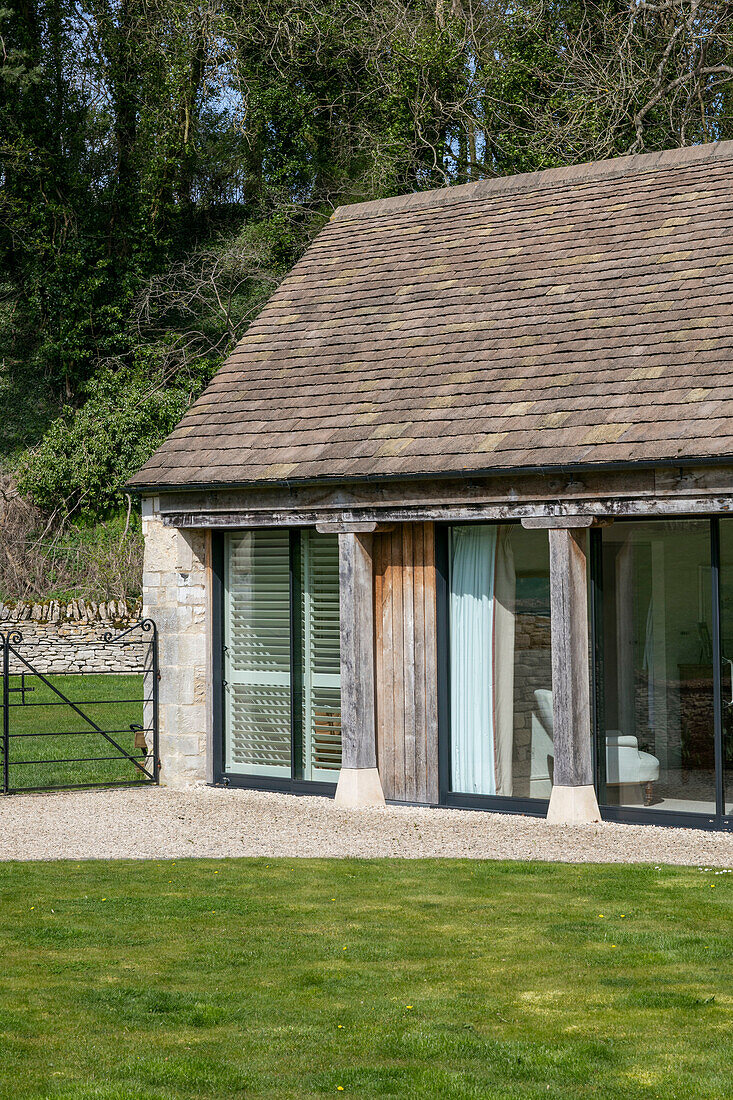 Patio doors and tiled roof exterior of Gloucestershire barn conversion UK