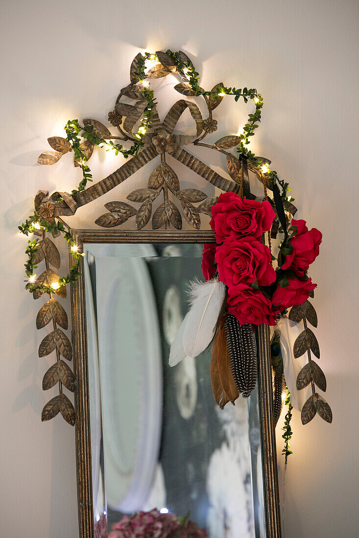 Red roses on vintage mirror on Hove apartment East Sussex UK