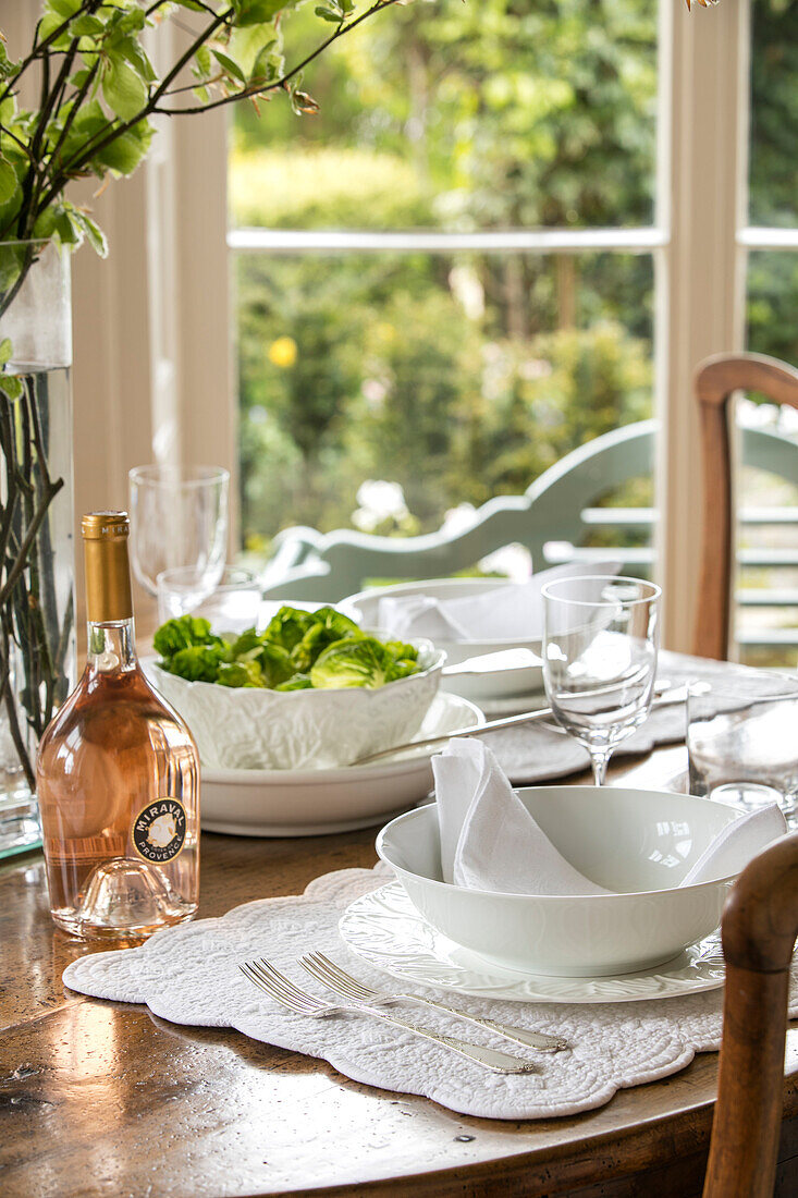Place setting with rose and salad in Grade II listed villa Arundel West Sussex UK