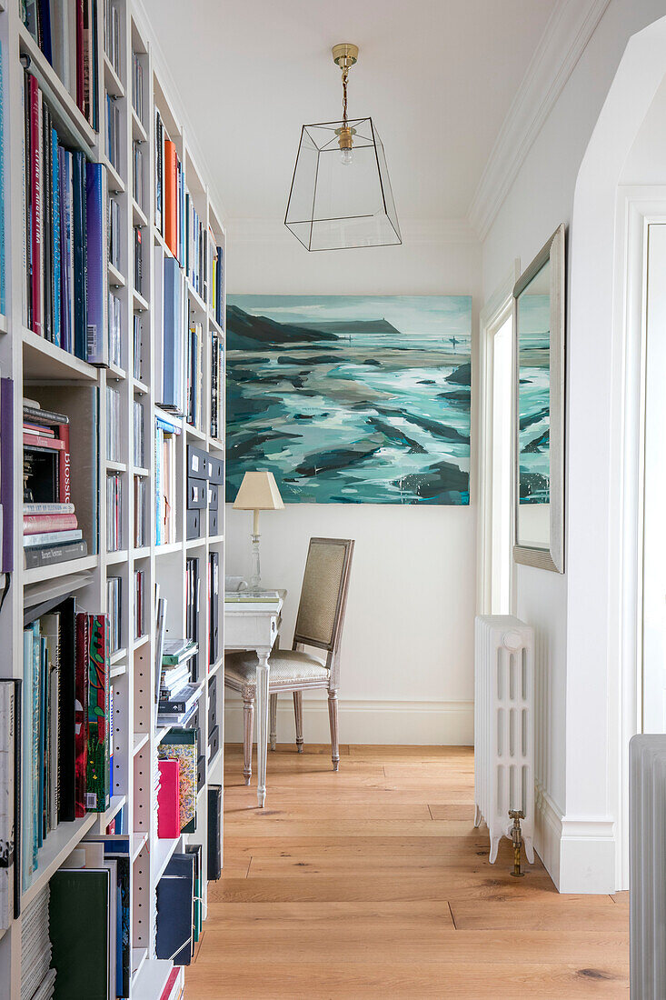 Seascape canvas with bookcase in Grade II listed villa Arundel West Sussex UK