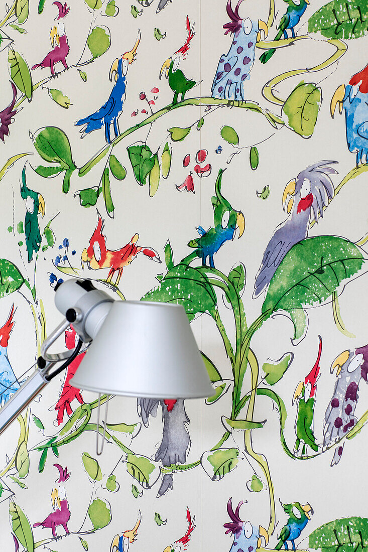 Silver lamp with Roald Dahl style wallpaper in Sevenoaks home Kent UK