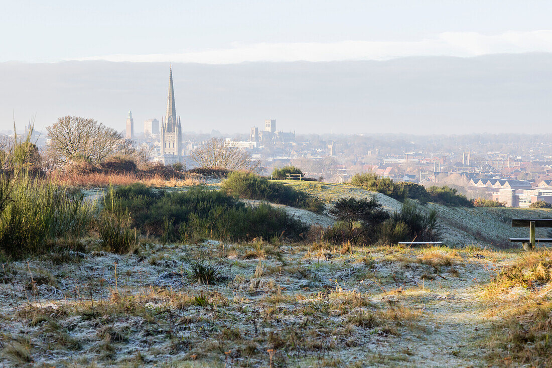 View of the spires and city of Norwich in winter frost Norfolk England