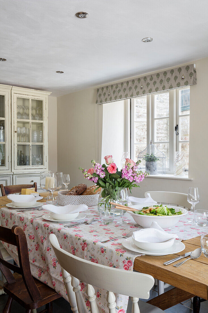 Cath Kidston tablecloth and place settings in Grade II listed Georgian farmhouse Somerset, UK