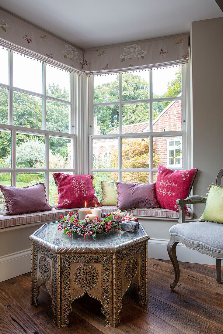 Octagonal table from Java with window seat in Hampshire country house UK