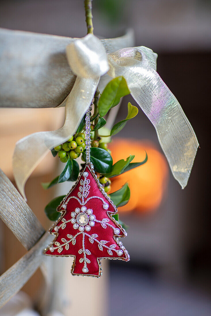 Jewelled tree ornament and ribbon with leaves Hampshire UK