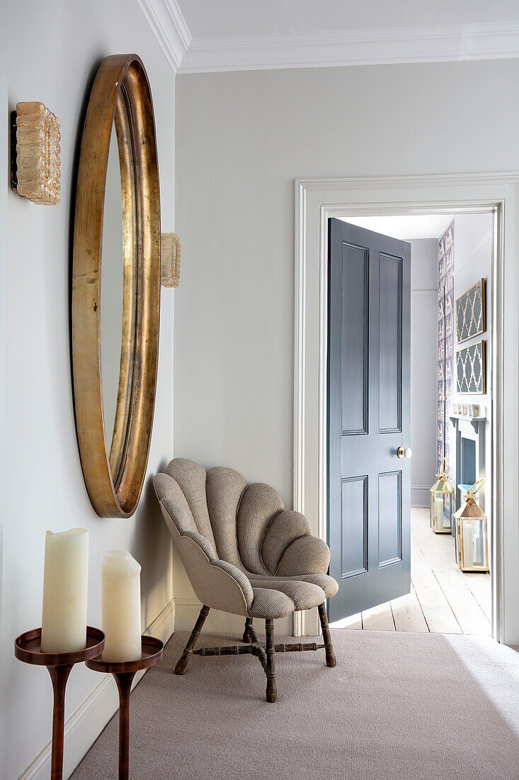 Shell chair with large vintage mirror in hallway extension of Victorian villa Tunbridge Wells Kent UK