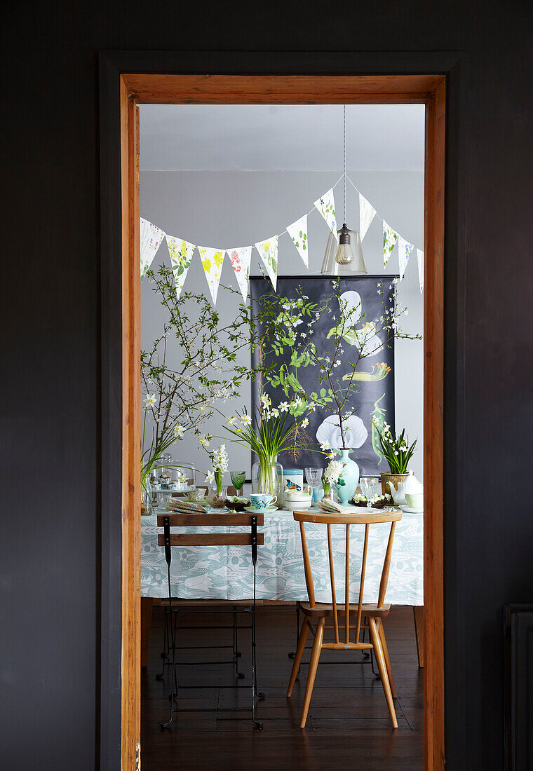 Easter Table setting through doorway with spring flowers