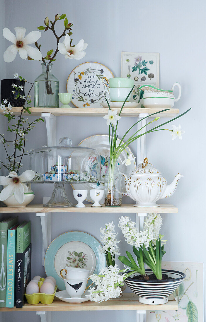 Easter shelf stacked with spring bulbs and blossom and fine chaina