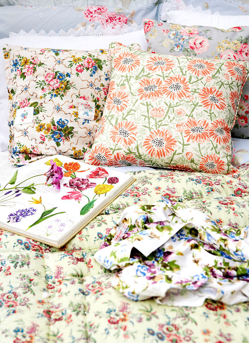 Floral cushions and gardening book in conservatory of Isle of Wight home UK