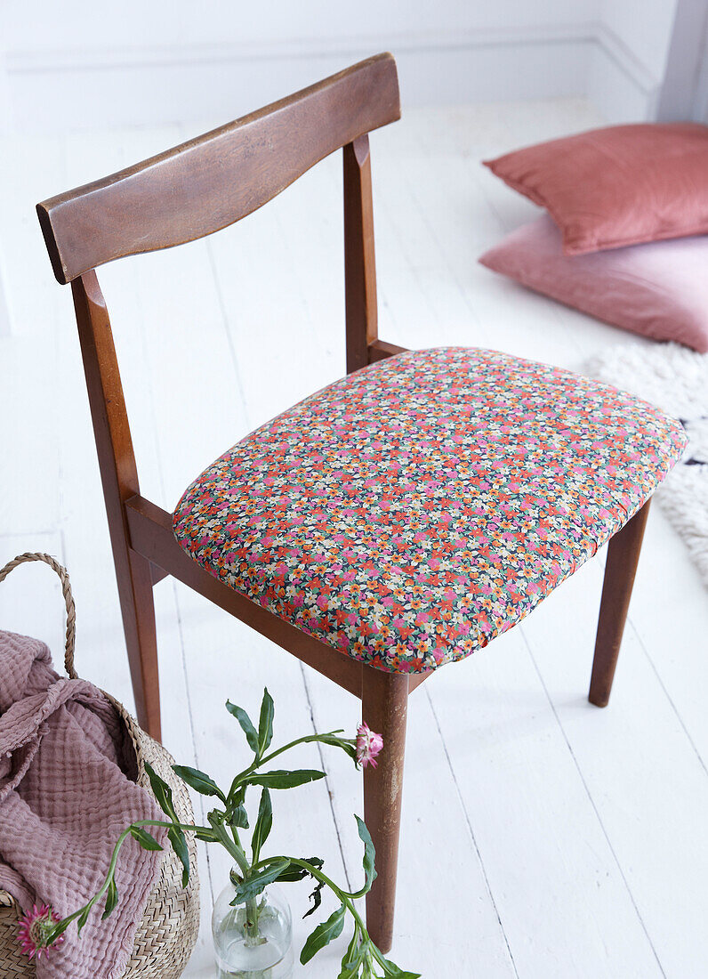 Vintage wooden chair with floral fabric seat