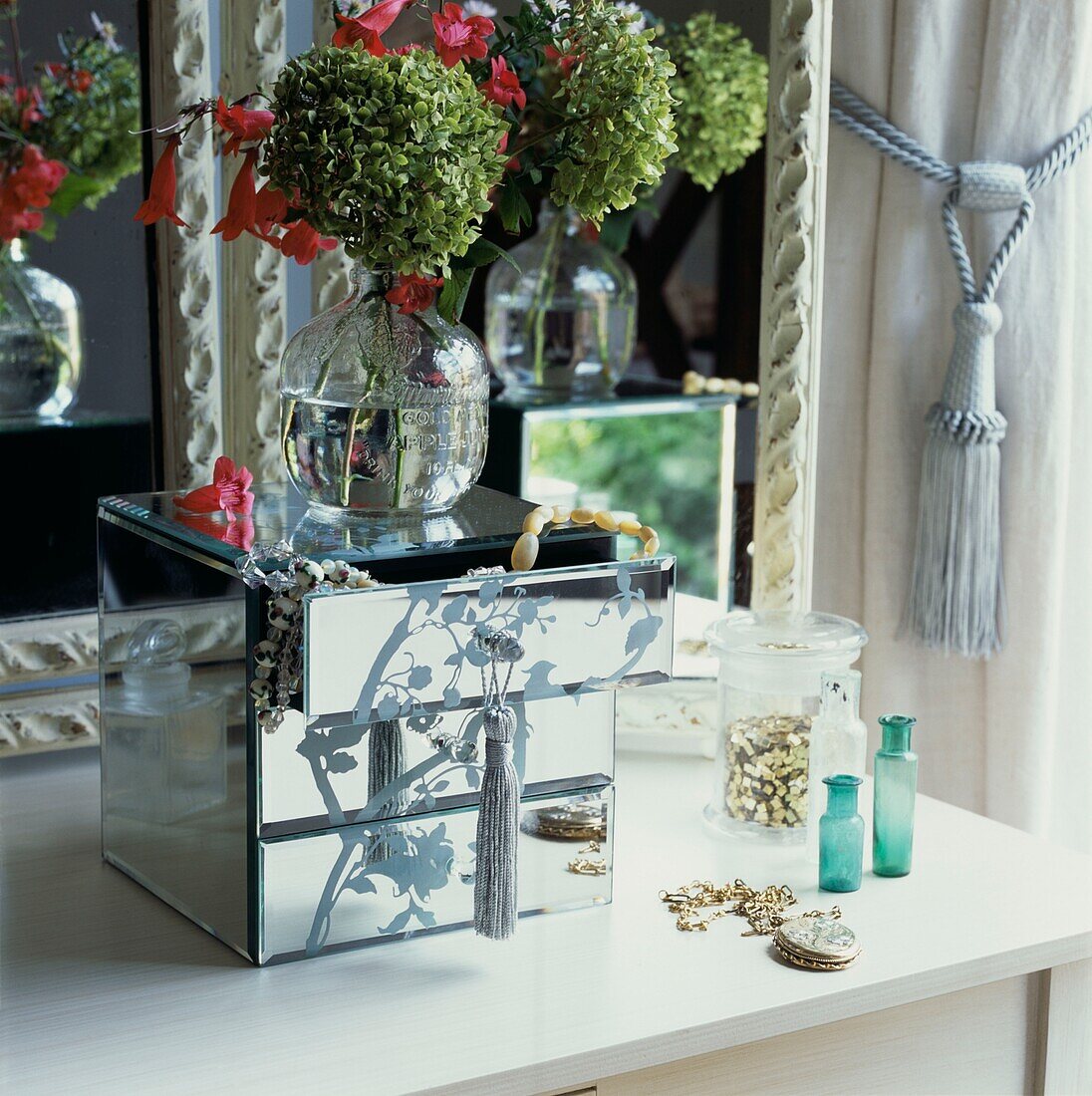Mirrored jewellery box on a dressing table