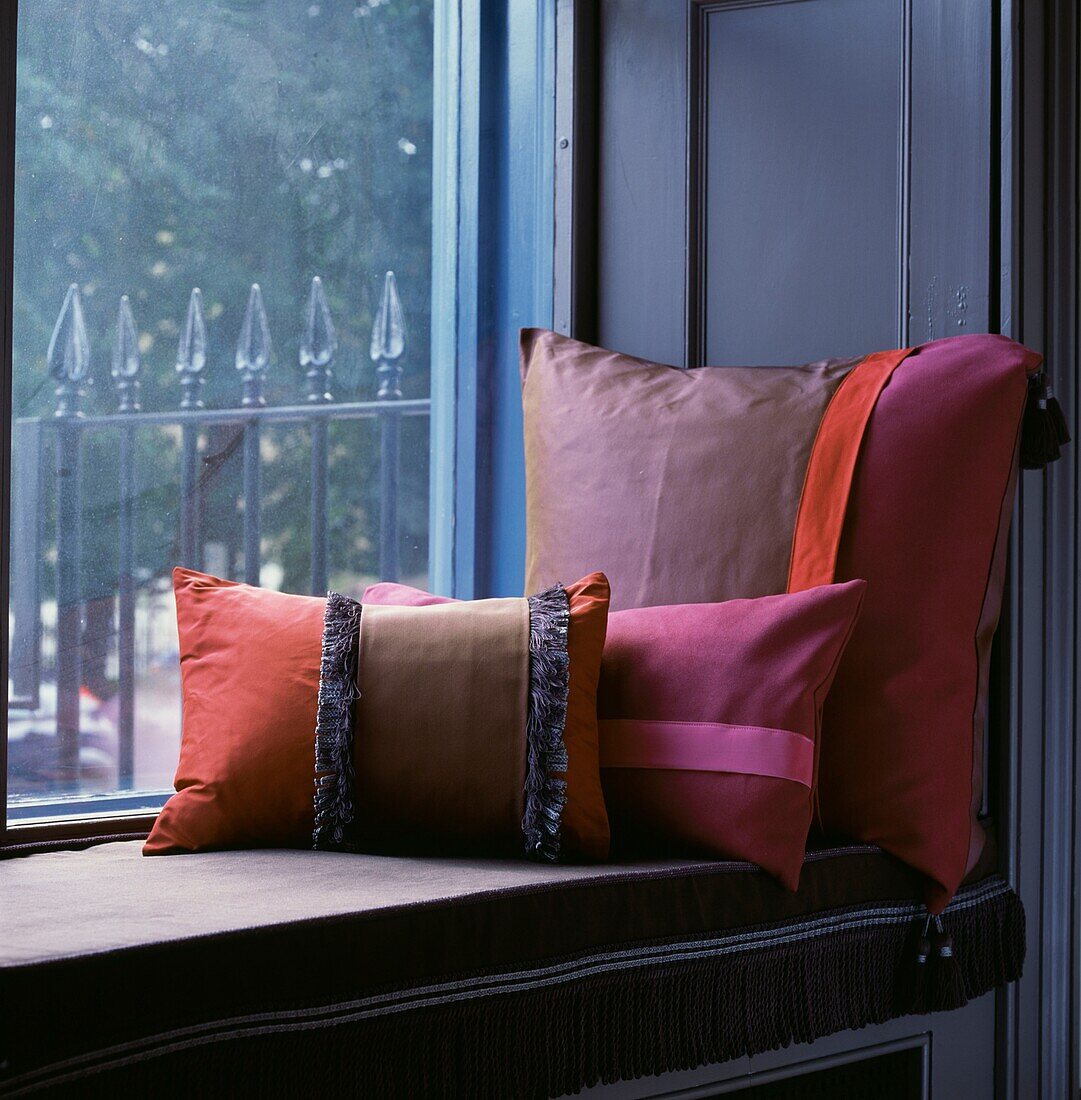 Quiet space on a window seat with colourful cushions
