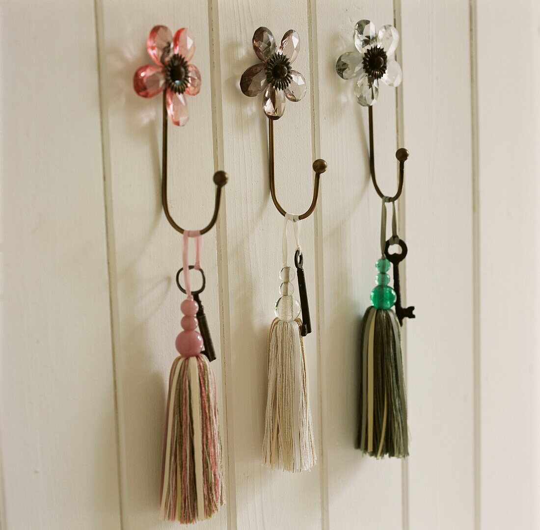 Painted panelled wall with key hooks
