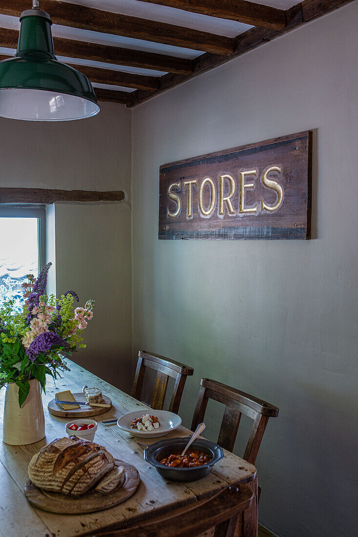 Dining table with vintage sign
