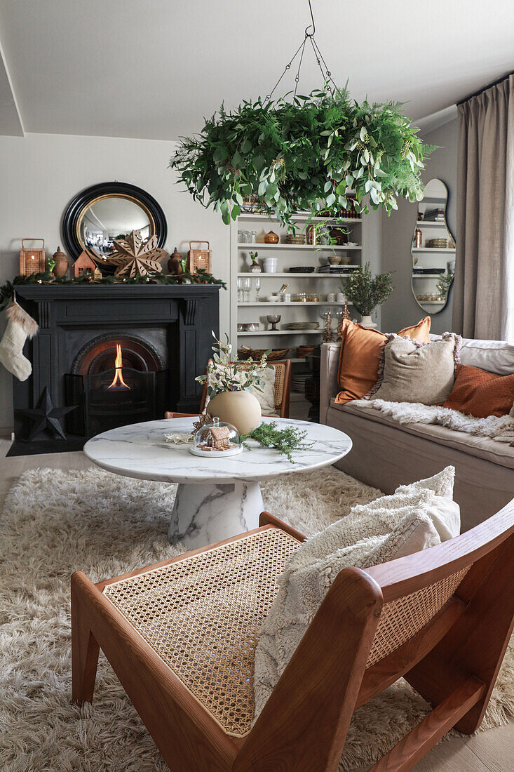 Cosy living room with winter decoration and open fireplace
