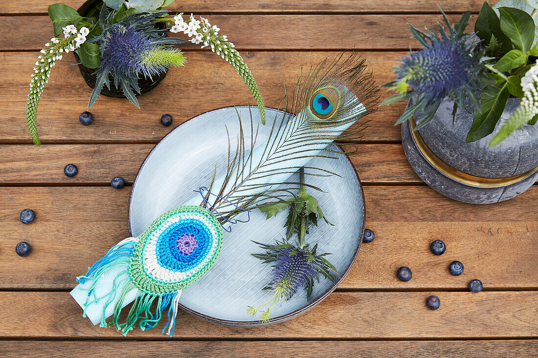 Napkin ring with crocheted peacock feather