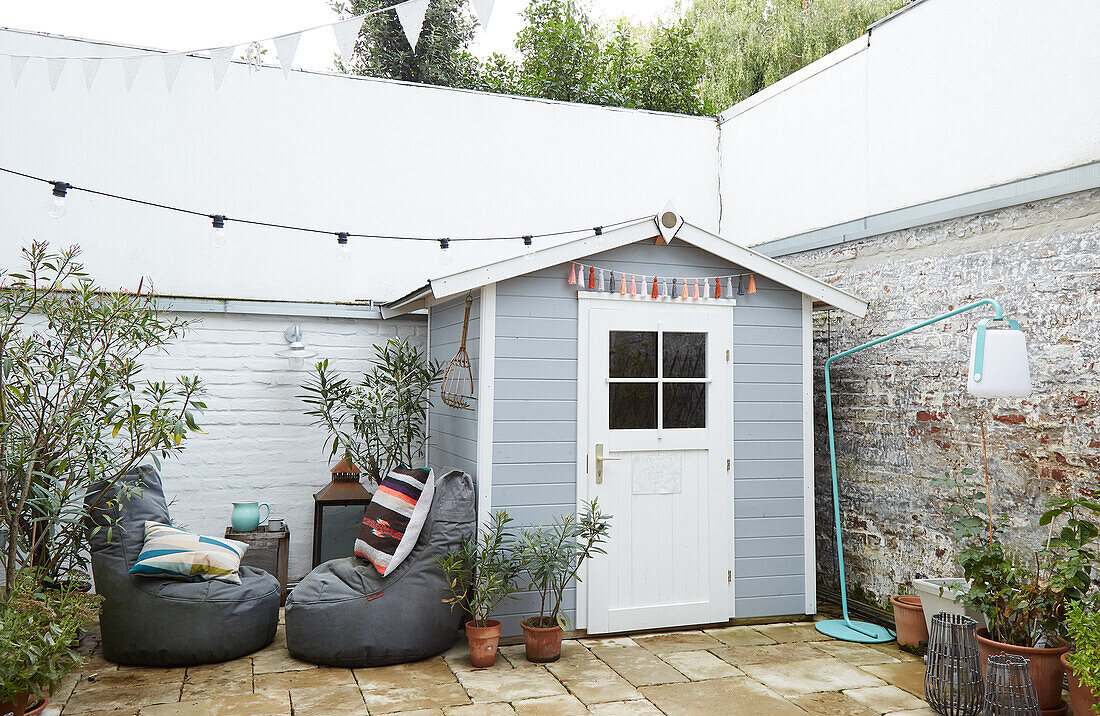 Garden shed, beanbags and fairy lights on terrace