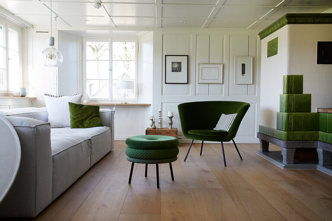 Living room with green accents and wooden floor