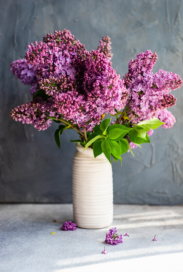 Minimalistic home interior decor with lilac flower bouquet