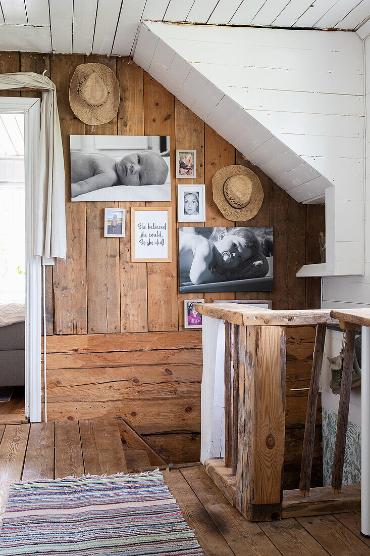Rustic interior with wood paneling and vintage photo wall