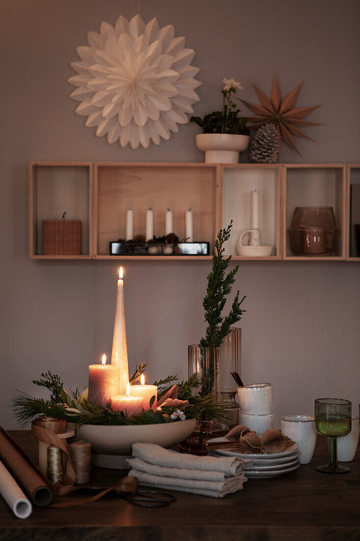 Christmas decorations with candles, twigs and paper stars