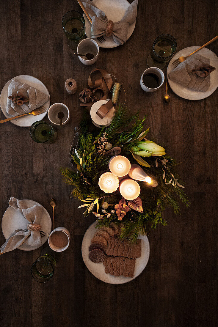 Christmas table setting with Advent decorations and cookies