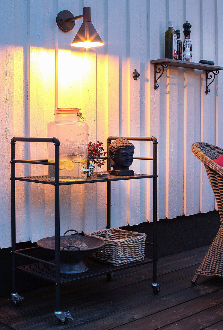 Black bar cart on an illuminated terrace