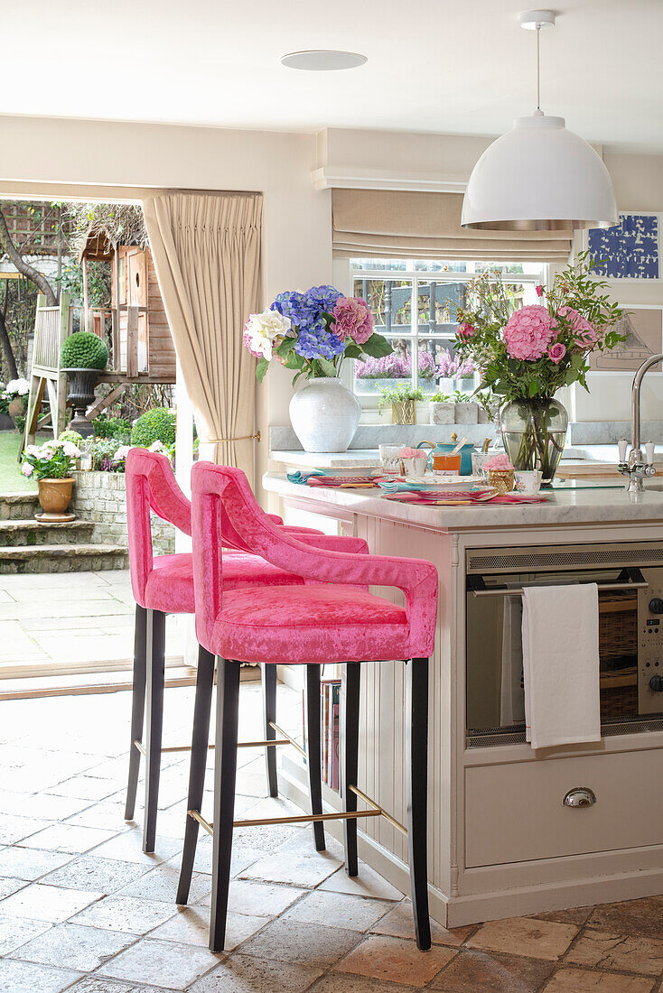 Kitchen island and pink bar stools