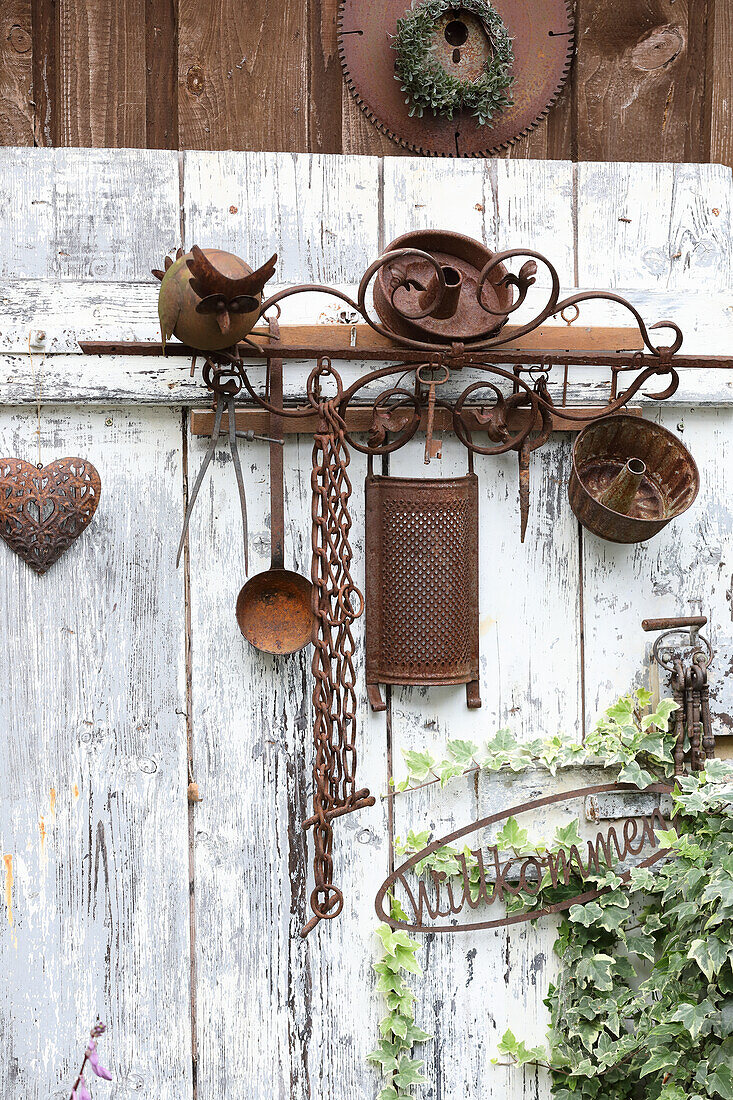 Rusty kitchen utensils as a garden decoration