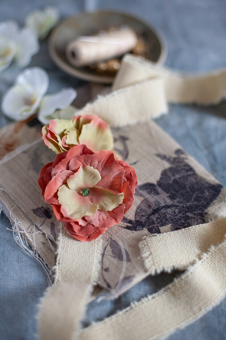 Fabric ribbon with artificial flowers