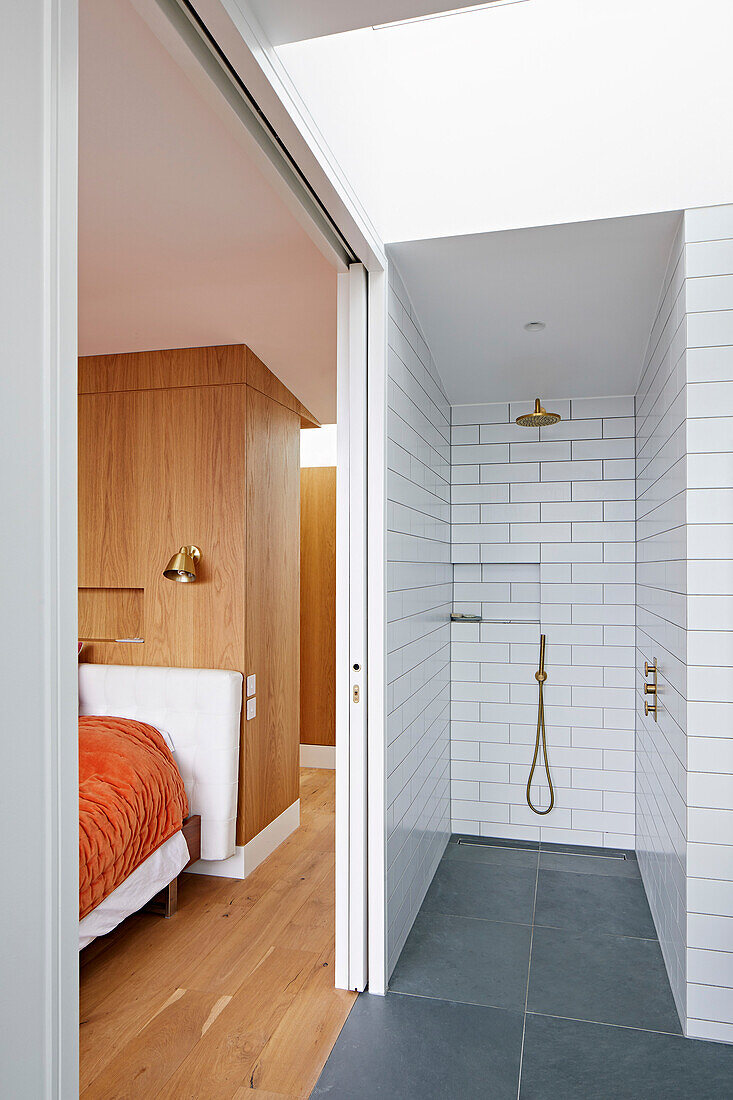 Shower and bedroom, separated by sliding door
