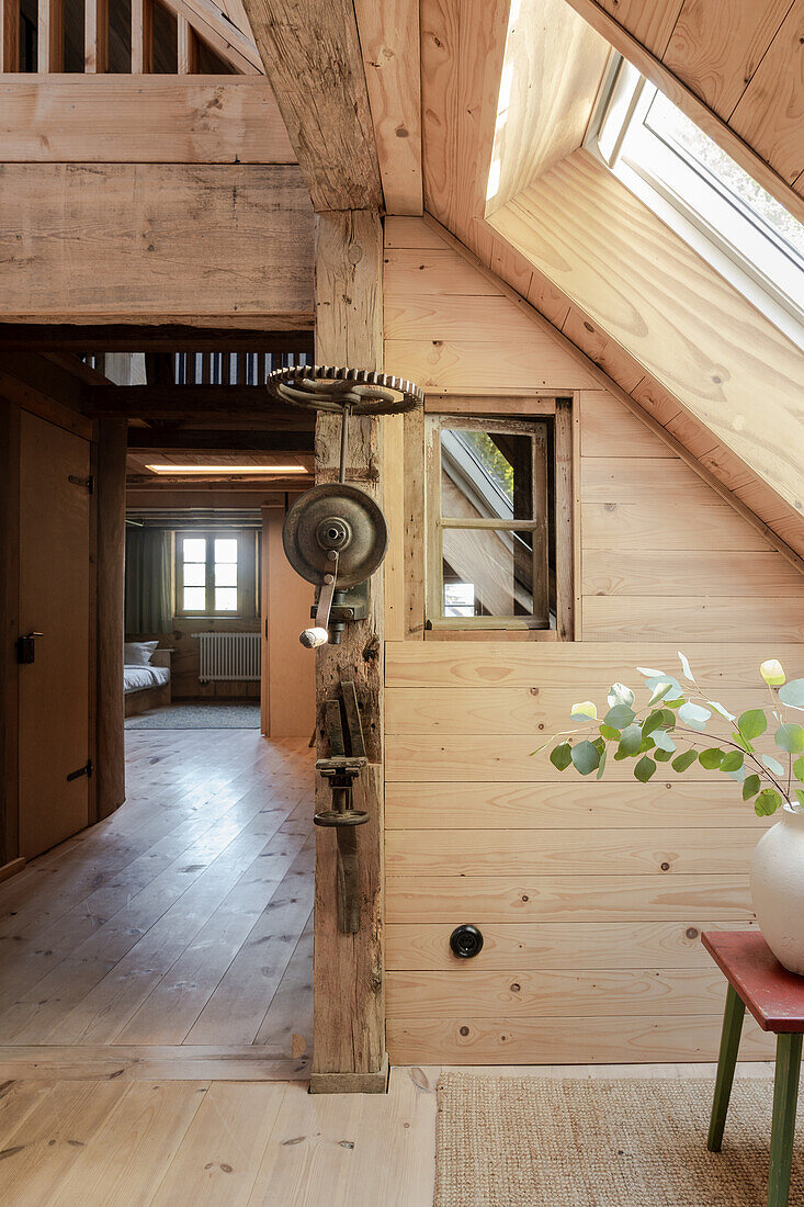 Hallway design with recycled wood in the attic room